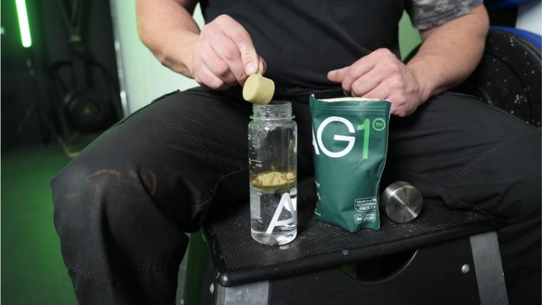 Our tester dumping a scoop of AG1.