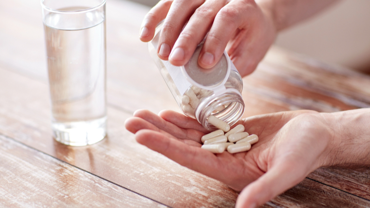 bcaa pills in hand