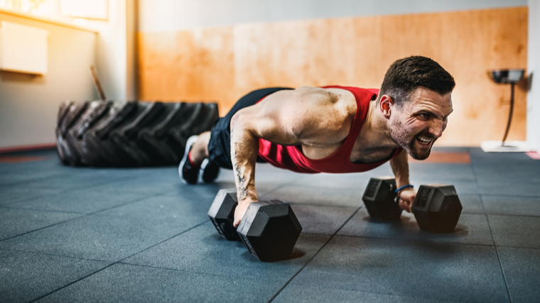man performing renegade row